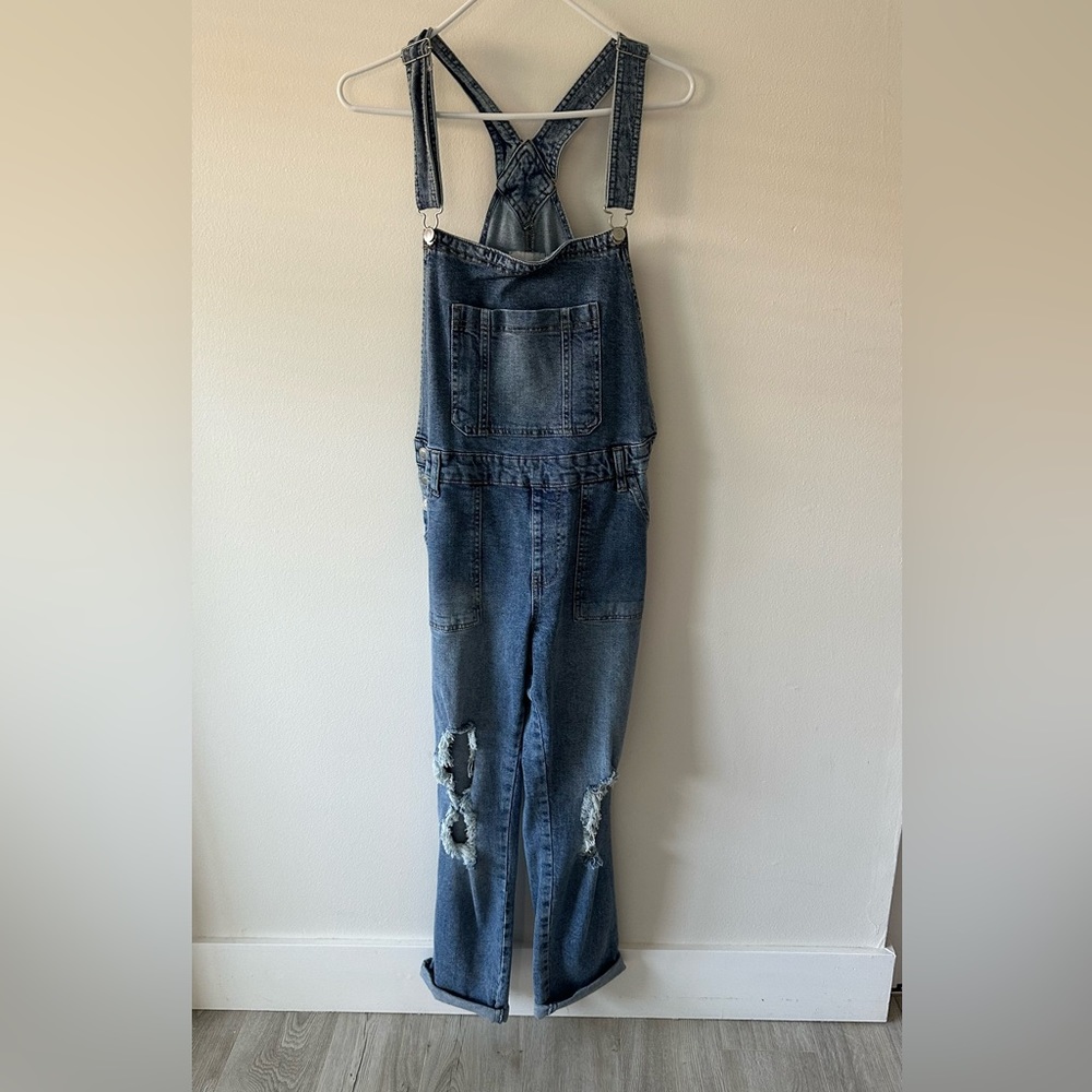 Blue distressed overalls
